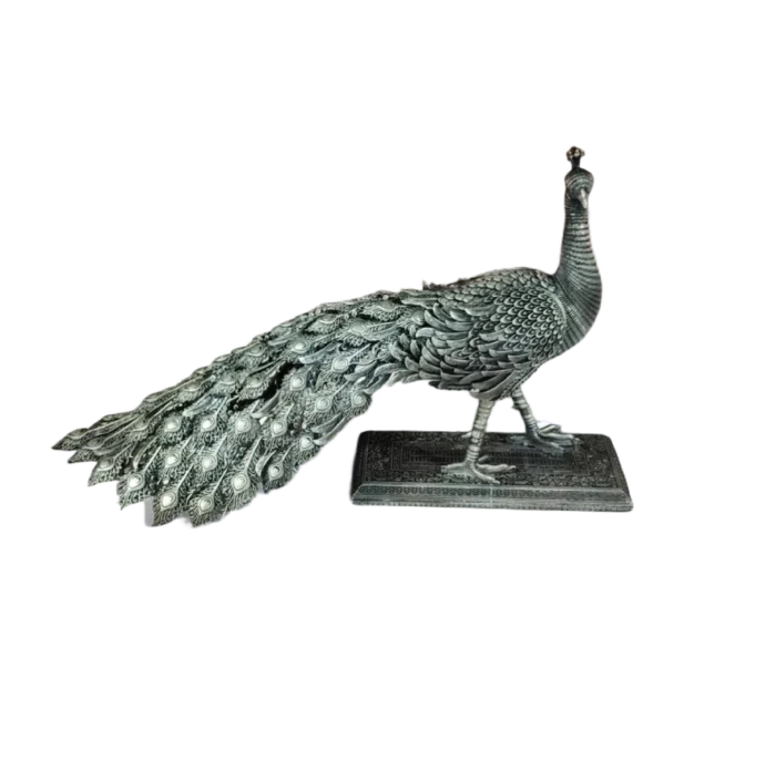 Intricately Carved Metal Peacock Statue - Image 1
