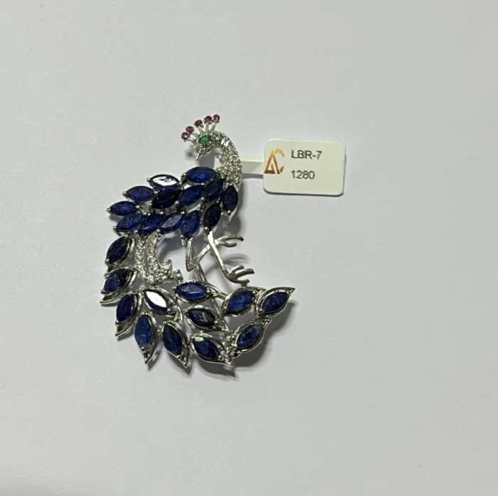 Majestic Sterling Silver Peacock Brooch with Blue Sapphires - Image 1