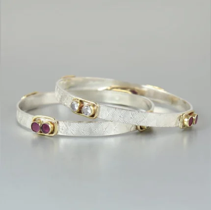 Textured Silver Bangle with Gold Accents & Ruby Gemstones