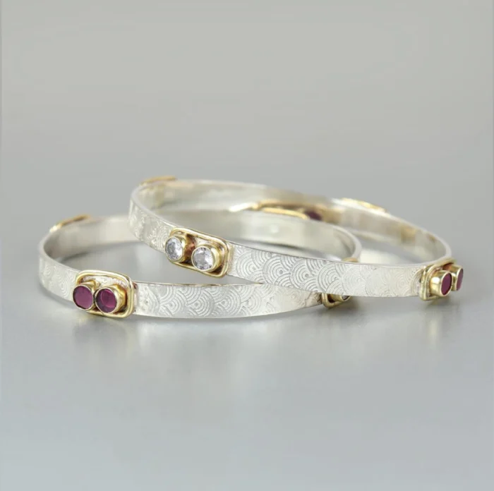 Textured Silver Bangle with Gold Accents & Ruby Gemstones - Image 1