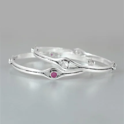 Sleek Silver Bangles with Ruby and Clear Gemstone Accents