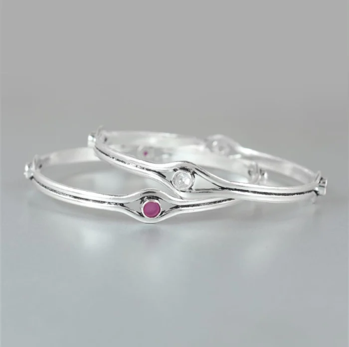 Sleek Silver Bangles with Ruby and Clear Gemstone Accents - Image 1