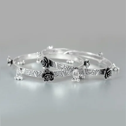 Oxidized Silver Bangles with Floral Motifs and Dangling Charms